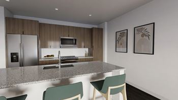 A kitchen with a granite countertop and a refrigerator with a water dispenser.